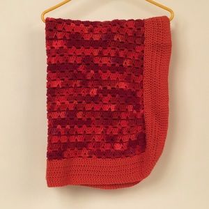 Crocheted throw blanket.